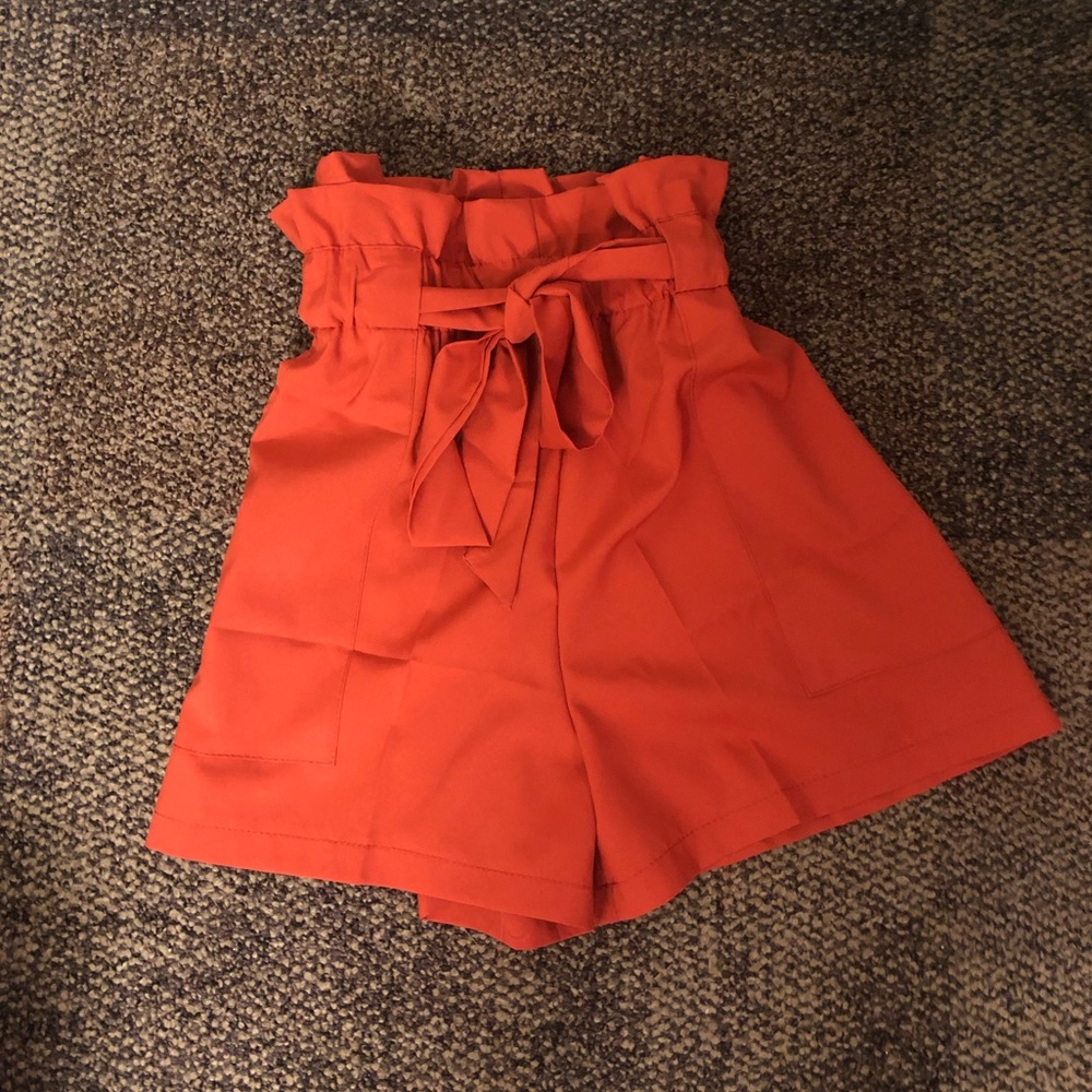 NWOT orange shorts that tie in the front